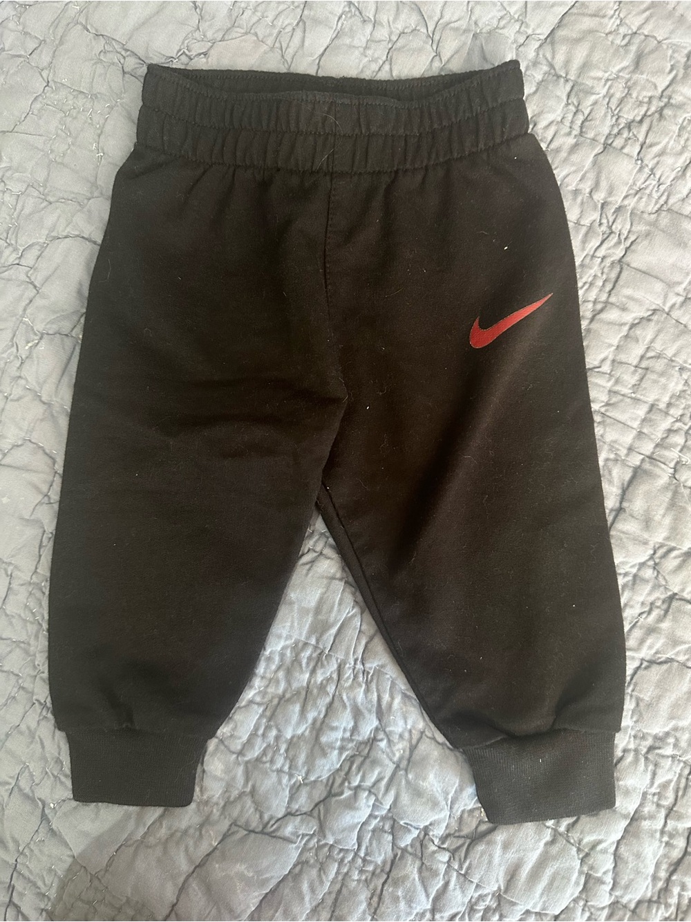 Nike Black Kids Sweatpants with Red Swoosh